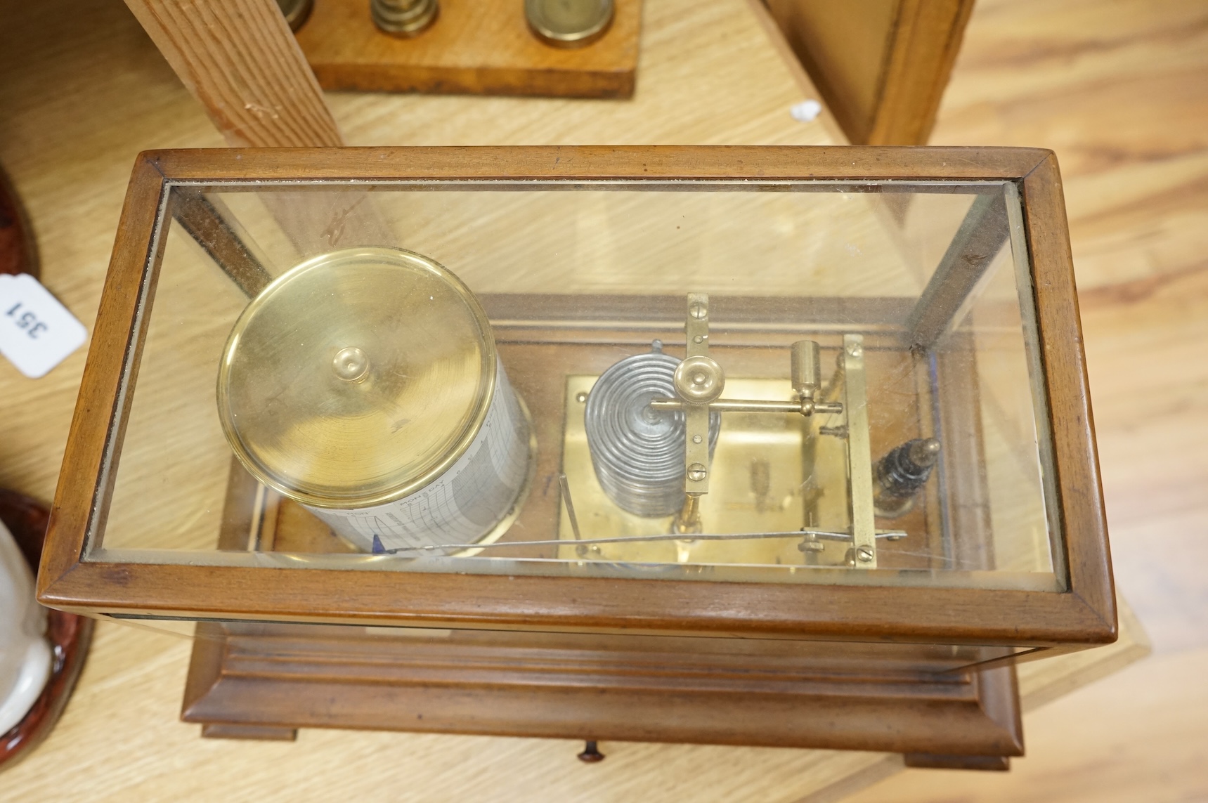 An early 20th century oak cased barograph by Finnigans Ltd., Manchester & Liverpool, with integral drawer underneath containing spare papers